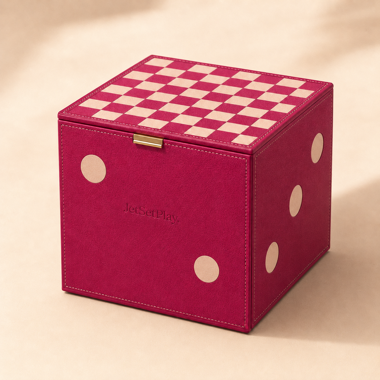 Raspberry leather cube shaped like a die with a checkerboard playing surface on its lid
